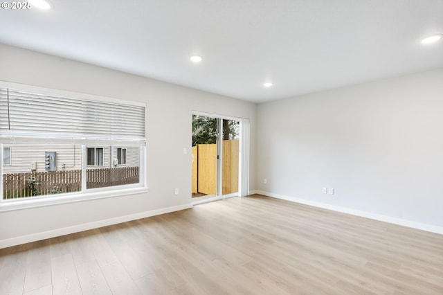 21190 SW Ortiz Ln, Beaverton, OR 97003 - empty room featuring recessed lighting, light wood finished floors, and baseboards