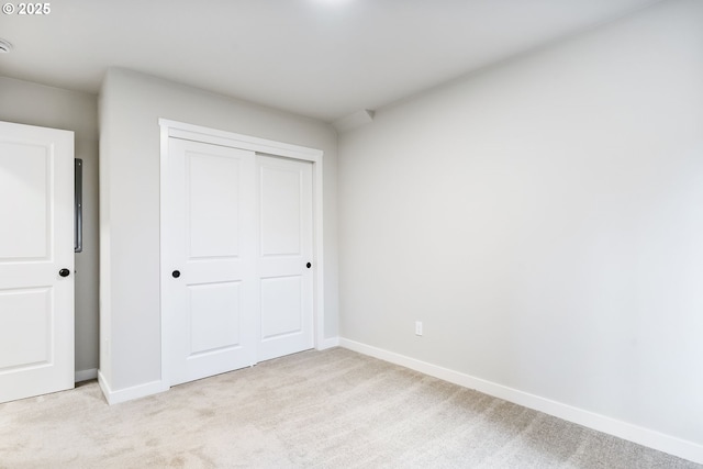 21190 SW Ortiz Ln, Beaverton, OR 97003 - unfurnished bedroom with light carpet, baseboards, and a closet
