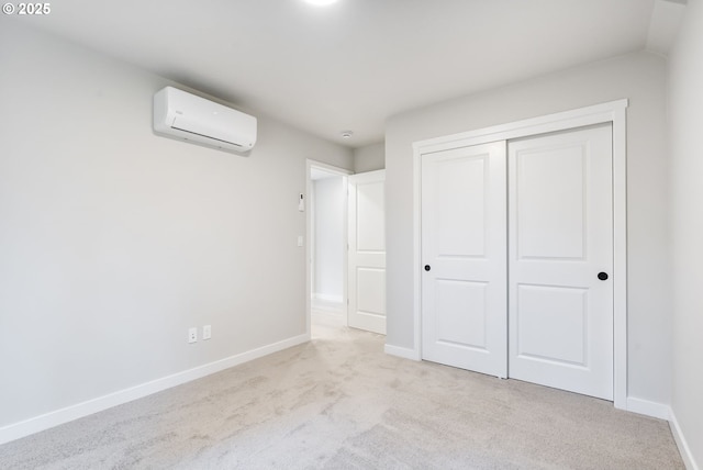 21190 SW Ortiz Ln, Beaverton, OR 97003 - unfurnished bedroom featuring carpet floors, baseboards, a wall mounted AC, and a closet