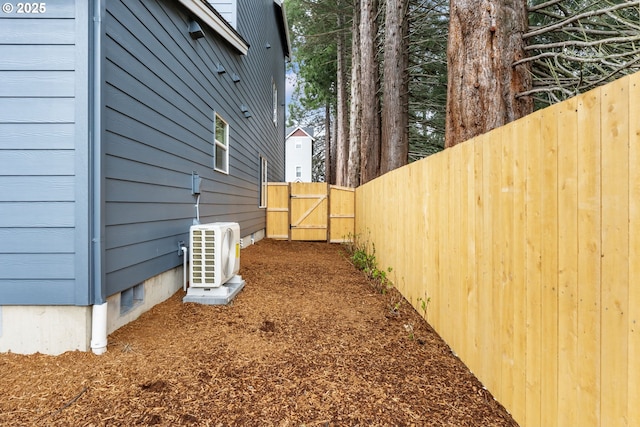 21190 SW Ortiz Ln, Beaverton, OR 97003 - view of property exterior featuring fence, ac unit, and a gate