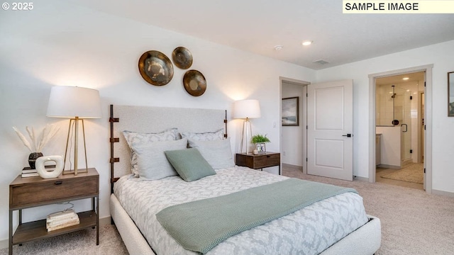 bedroom with carpet floors and connected bathroom