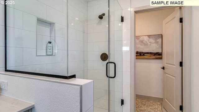 bathroom featuring an enclosed shower