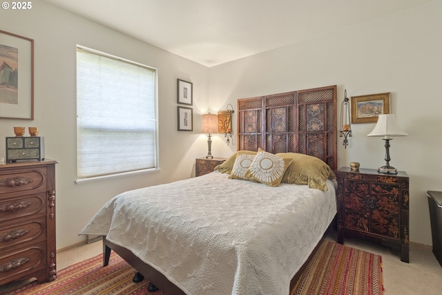 carpeted bedroom with baseboards
