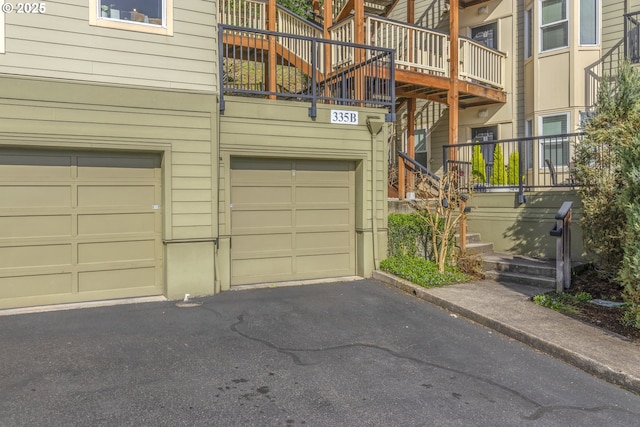 garage with asphalt driveway