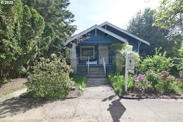 craftsman-style home featuring covered porch