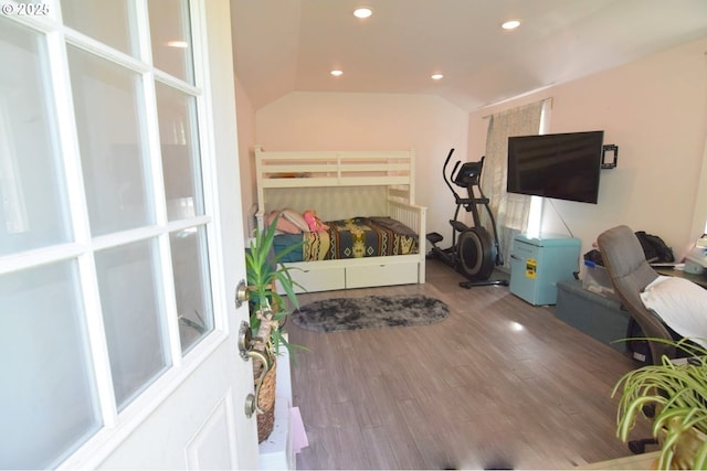 bedroom featuring vaulted ceiling, recessed lighting, and wood finished floors