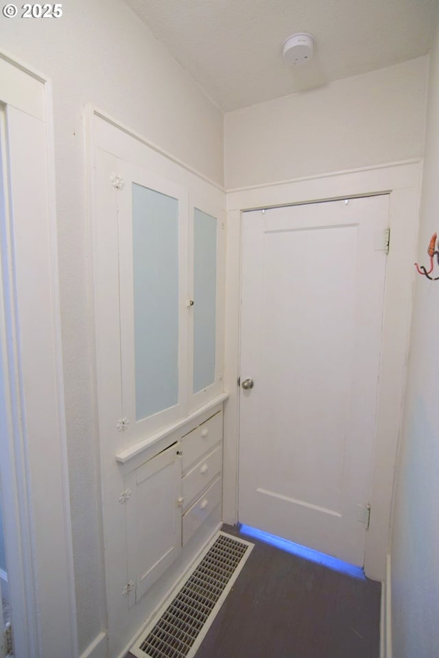 entryway featuring dark wood-style floors