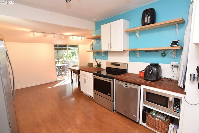 kitchen featuring open shelves, wood finished floors, wooden counters, white cabinets, and stainless steel appliances