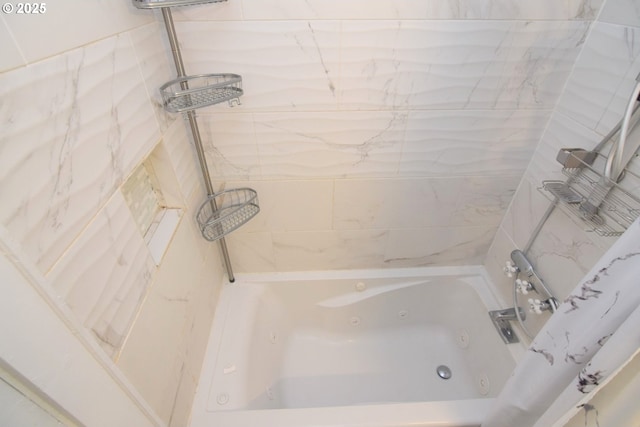 bathroom with a combined bath / shower with jetted tub