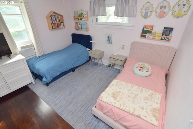 bedroom featuring wood finished floors