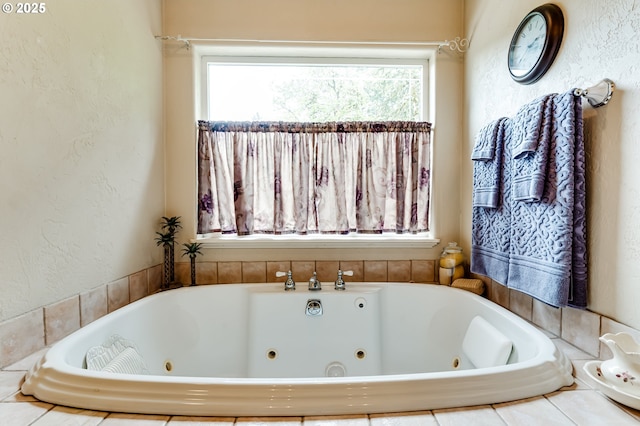 bathroom with a relaxing tiled tub