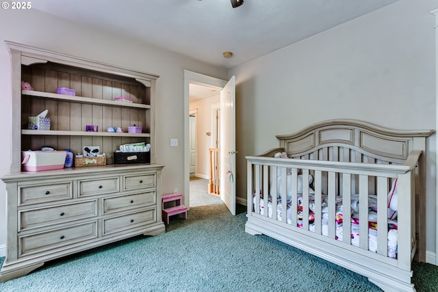 carpeted bedroom with a crib