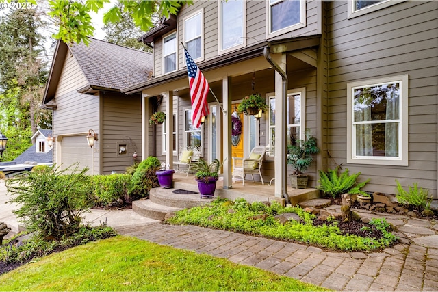 entrance to property with a porch and a garage