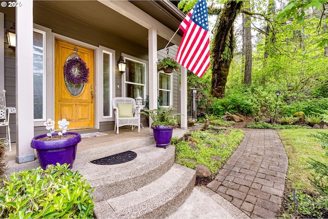 doorway to property featuring covered porch