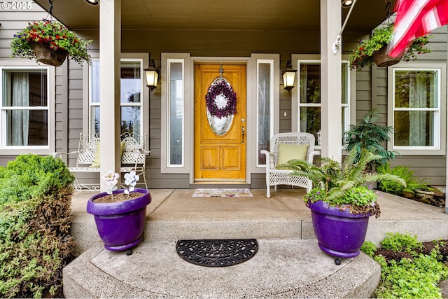 property entrance with covered porch