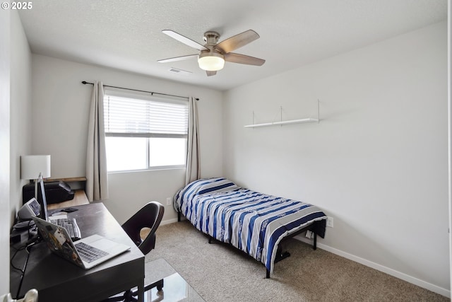 bedroom with carpet floors, a ceiling fan, visible vents, and baseboards