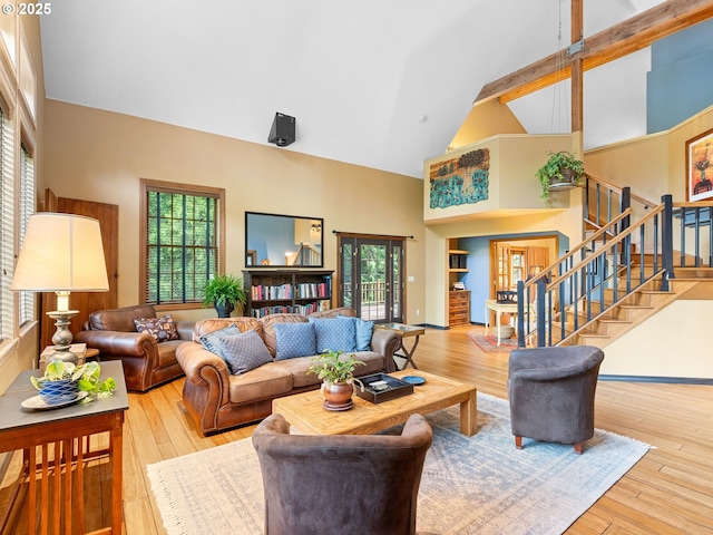 33901 Merrill Creek Rd, Deer Island, OR 97054 - living room featuring high vaulted ceiling, healthy amount of natural light, stairway, and wood-type flooring