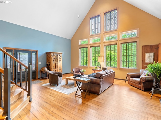 33901 Merrill Creek Rd, Deer Island, OR 97054 - living room with high vaulted ceiling, stairs, and light wood-type flooring