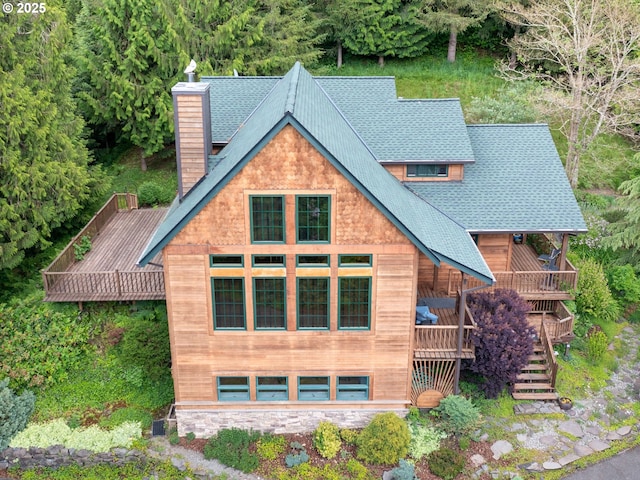 33901 Merrill Creek Rd, Deer Island, OR 97054 - view of front of house with a chimney, roof with shingles, a deck, and stairs