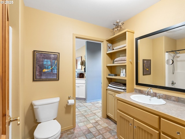 33901 Merrill Creek Rd, Deer Island, OR 97054 - full bathroom featuring toilet, stone finish floors, vanity, and a shower