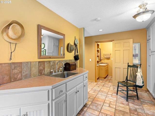 33901 Merrill Creek Rd, Deer Island, OR 97054 - kitchen with a sink, light countertops, tasteful backsplash, baseboards, and brick patterned flooring