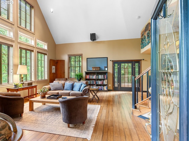 33901 Merrill Creek Rd, Deer Island, OR 97054 - living room with high vaulted ceiling, stairs, and light wood-style flooring