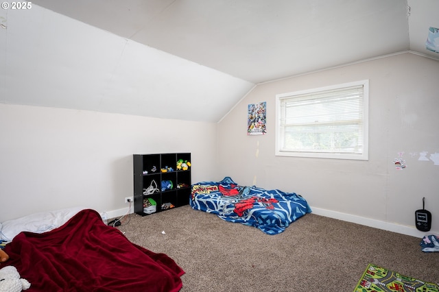 carpeted bedroom featuring lofted ceiling