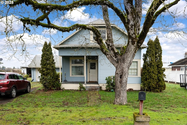 bungalow-style house featuring a front yard