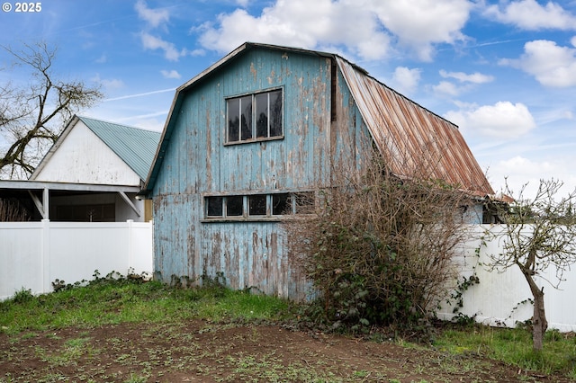 view of home's exterior featuring an outdoor structure