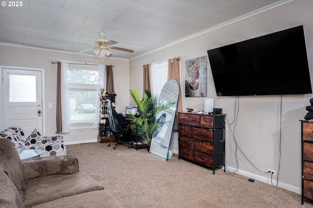 carpeted living room featuring ceiling fan and crown molding