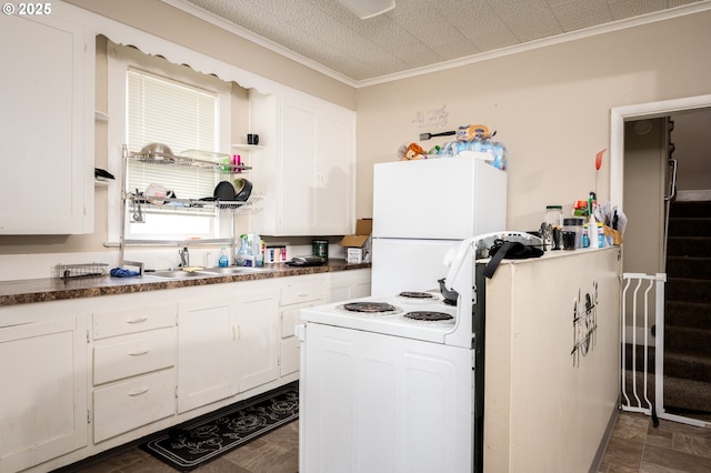 kitchen featuring sink, white cabinetry, white appliances, and ornamental molding