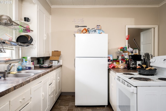 kitchen featuring sink, white appliances, white cabinetry, and crown molding