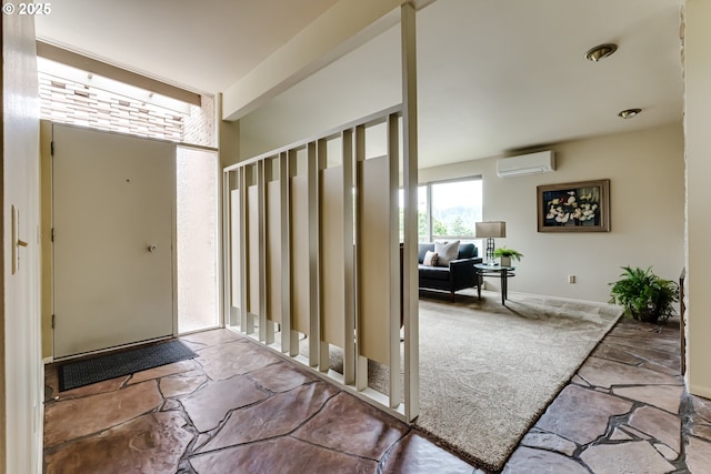 495 W 27th Ave, Eugene, OR 97405 - entrance foyer with a wall unit AC and stone finish flooring