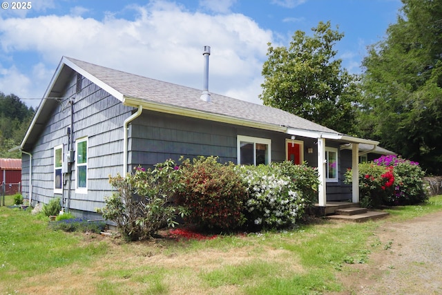 58798 Fairview Rd, Coquille, OR 97423 - view of front of home with covered porch and roof with shingles