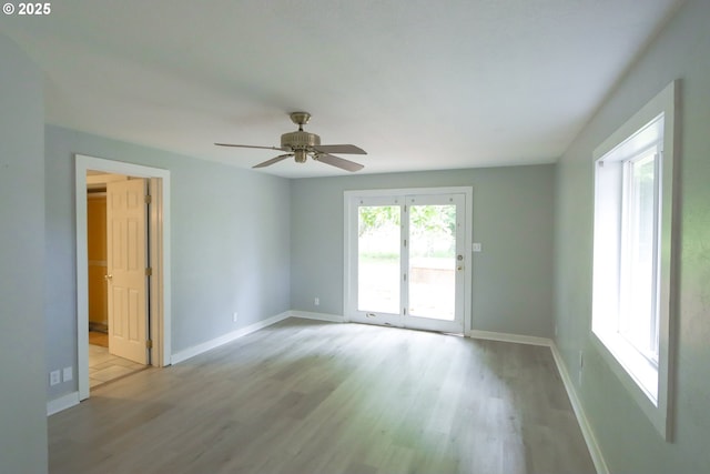 58798 Fairview Rd, Coquille, OR 97423 - empty room with wood finished floors, baseboards, and a ceiling fan