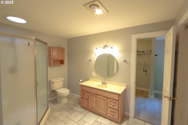 58798 Fairview Rd, Coquille, OR 97423 - full bath featuring a shower stall, vanity, toilet, tile patterned flooring, and baseboards