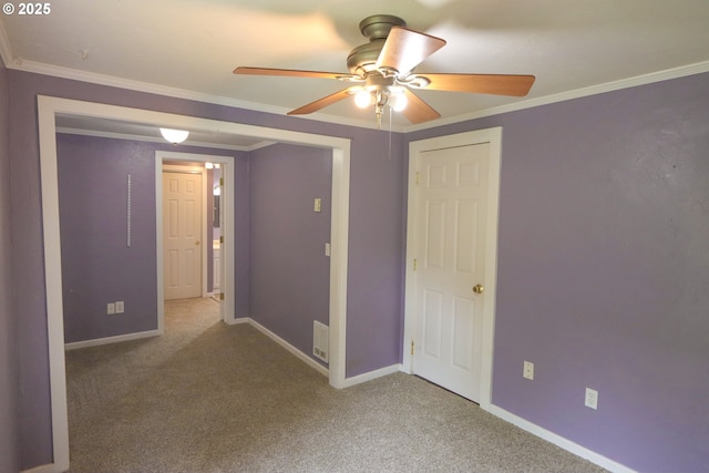 58798 Fairview Rd, Coquille, OR 97423 - unfurnished bedroom featuring carpet flooring, baseboards, ornamental molding, and a ceiling fan