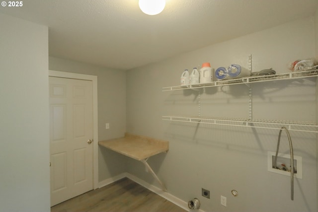 58798 Fairview Rd, Coquille, OR 97423 - laundry room with hookup for an electric dryer, wood finished floors, washer hookup, gas dryer hookup, and baseboards