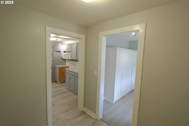 58798 Fairview Rd, Coquille, OR 97423 - hallway with light wood-type flooring and baseboards