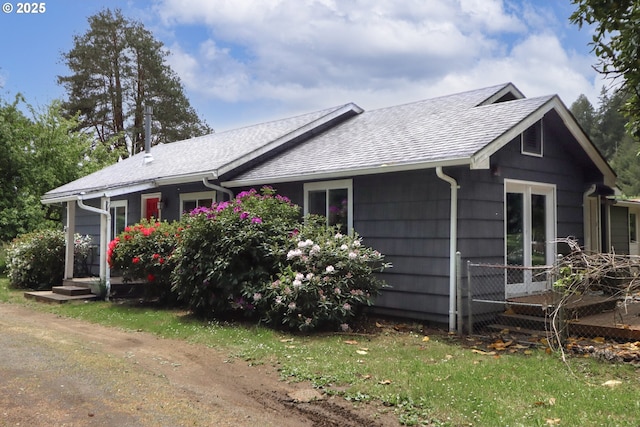 58798 Fairview Rd, Coquille, OR 97423 - view of home's exterior with a shingled roof and french doors