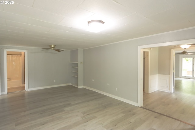58798 Fairview Rd, Coquille, OR 97423 - empty room with a ceiling fan, light wood-type flooring, and ornamental molding