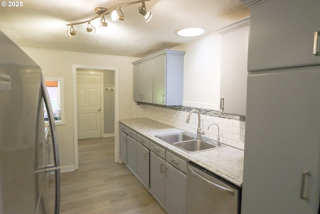 58798 Fairview Rd, Coquille, OR 97423 - kitchen with stainless steel appliances, a sink, decorative backsplash, gray cabinets, and light countertops