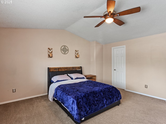 bedroom featuring vaulted ceiling, a ceiling fan, a textured ceiling, carpet, and baseboards