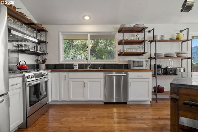 49867 Hills Creek Rd, Oakridge, OR 97463 - kitchen featuring white cabinetry, stainless steel appliances, open shelves, and a sink
