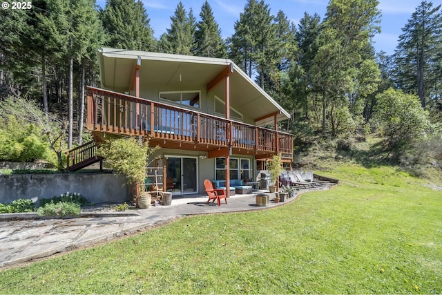49867 Hills Creek Rd, Oakridge, OR 97463 - rear view of house with a lawn, a patio, and a wooden deck