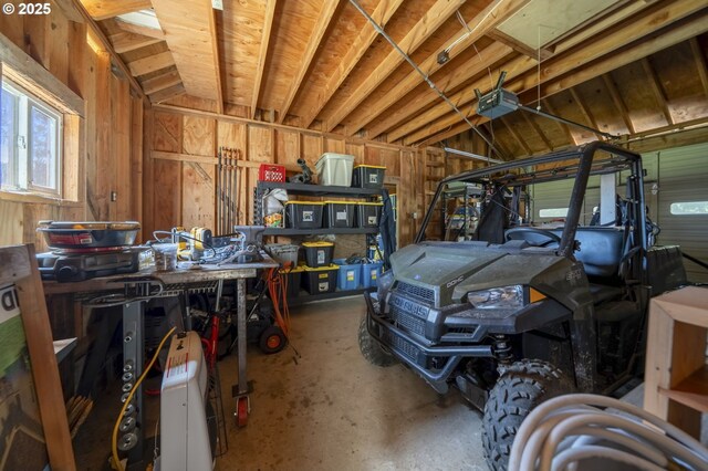 49867 Hills Creek Rd, Oakridge, OR 97463 - garage featuring a workshop area and a garage door opener