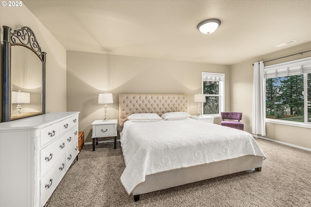 carpeted bedroom with baseboards