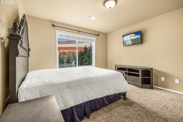 bedroom with carpet flooring, visible vents, and baseboards