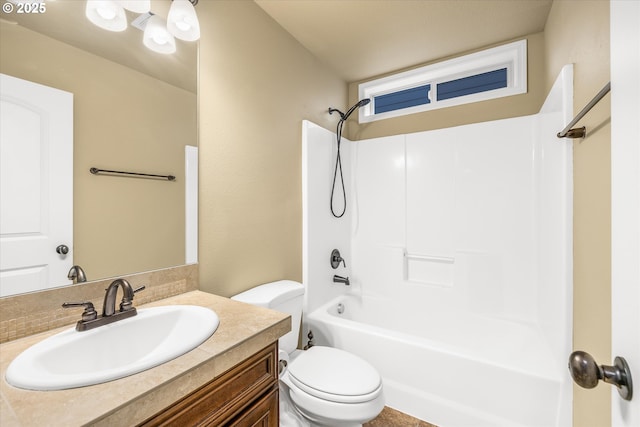 full bathroom featuring shower / bathing tub combination, vanity, and toilet