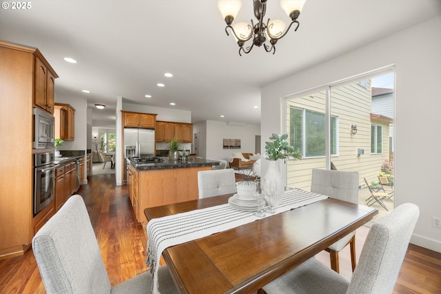12988 NW Tigon Ln, Portland, OR 97229 - dining area with plenty of natural light, a chandelier, recessed lighting, and dark wood-style flooring